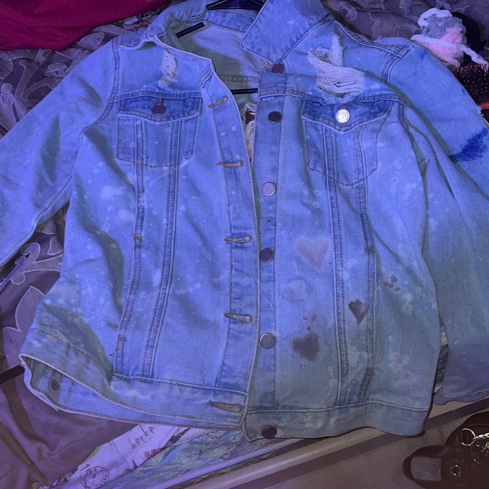 Light blue distressed, jean jacket with whites splatters